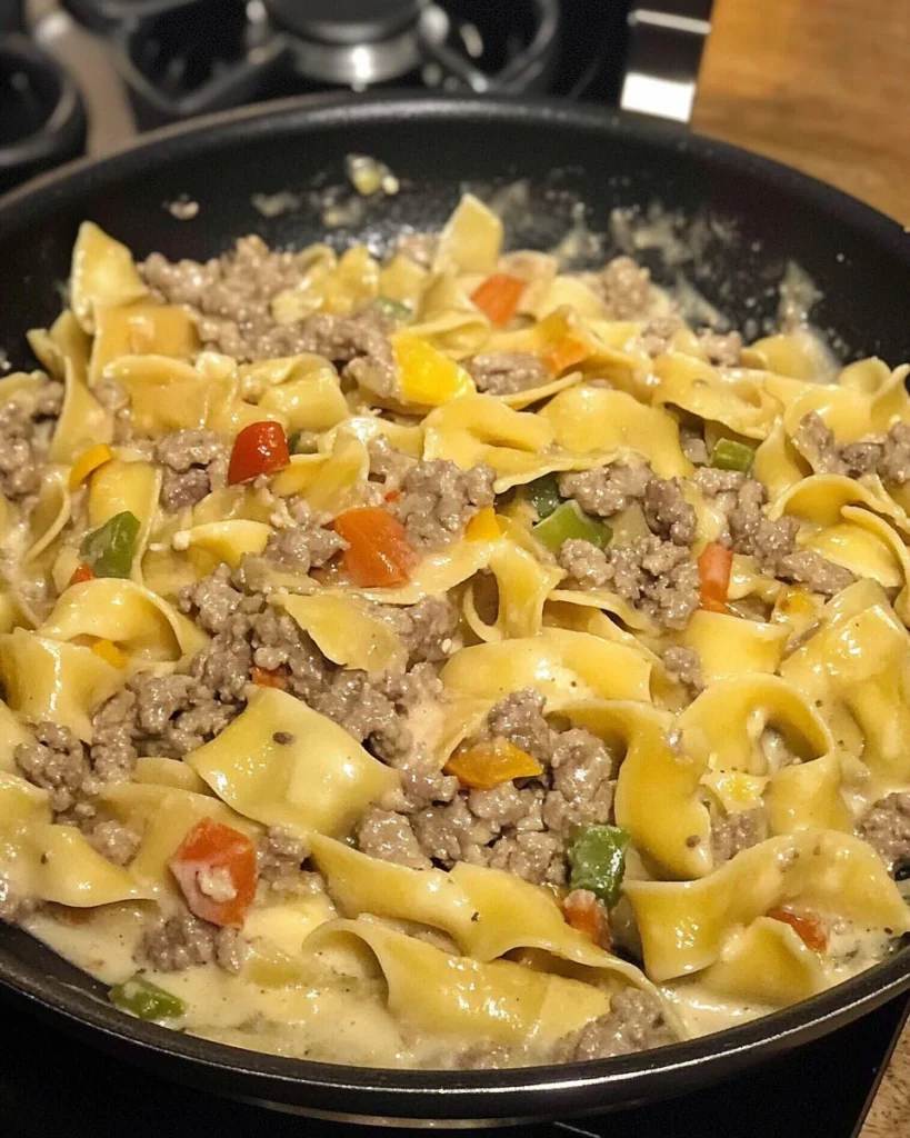Creamy tagliatelle panna dish with mushrooms and sausage