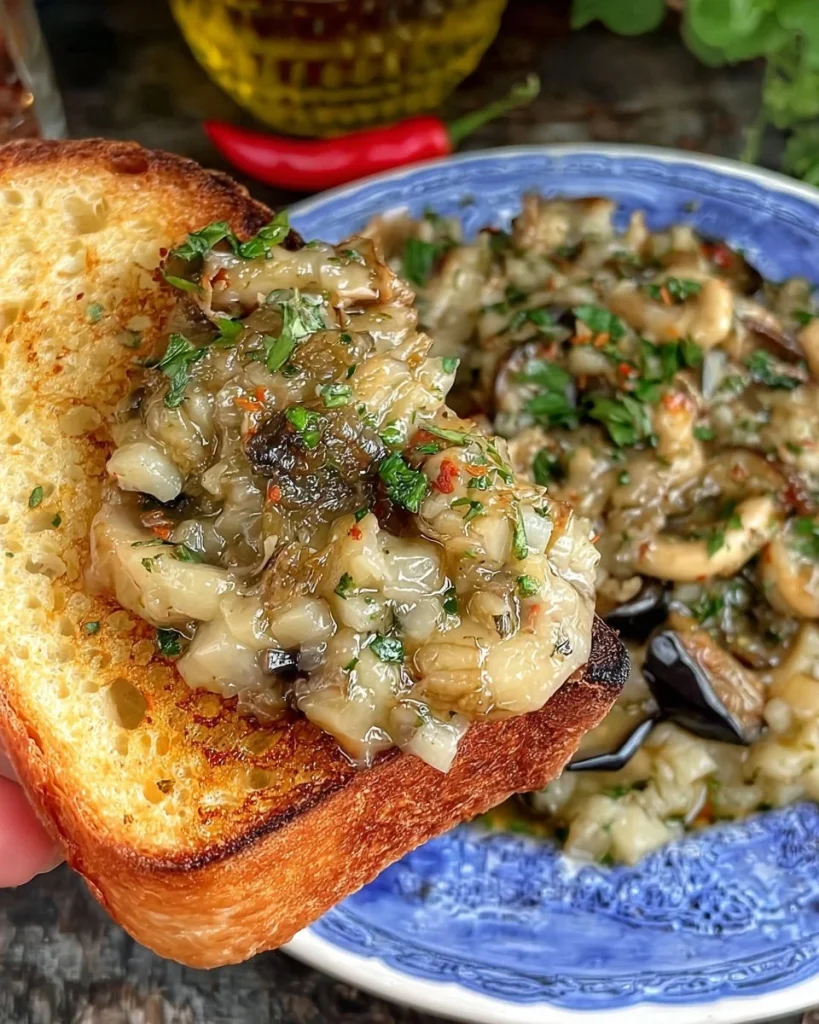 Piatto di Melanzana alla Quaglia servito con guarnizioni fresche.