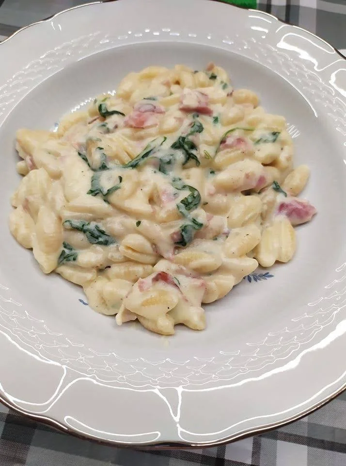 Pasta with potato cream, arugula, and speck